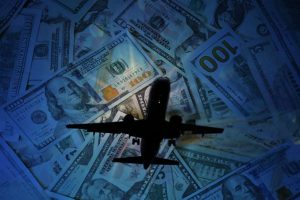 airliner flying over money graphic