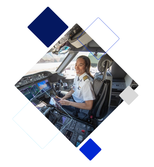 A female pilot in a cockpit