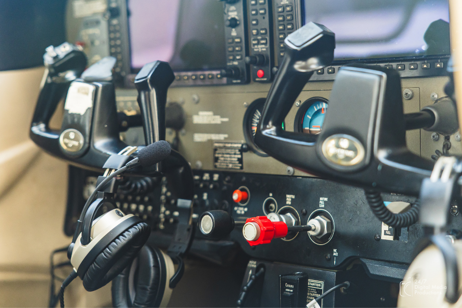 view from the inside of a Cessna 172 g1000 garmin cockpit with yolks and headset visible 