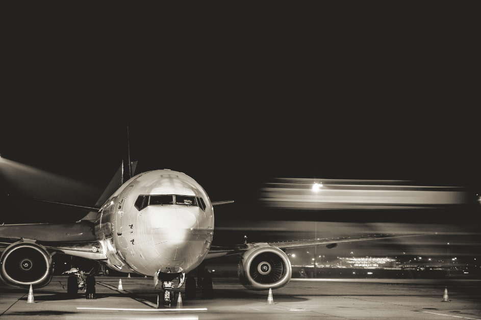 Commercial airliner on ramp black and white photo